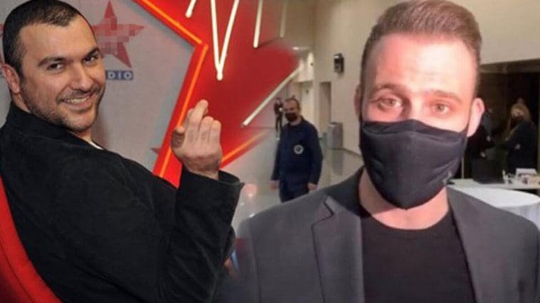 kerem bursin insulted in black t-shirt with a suit jacket wearing a mask and the singer bay jay laughing dressed in black