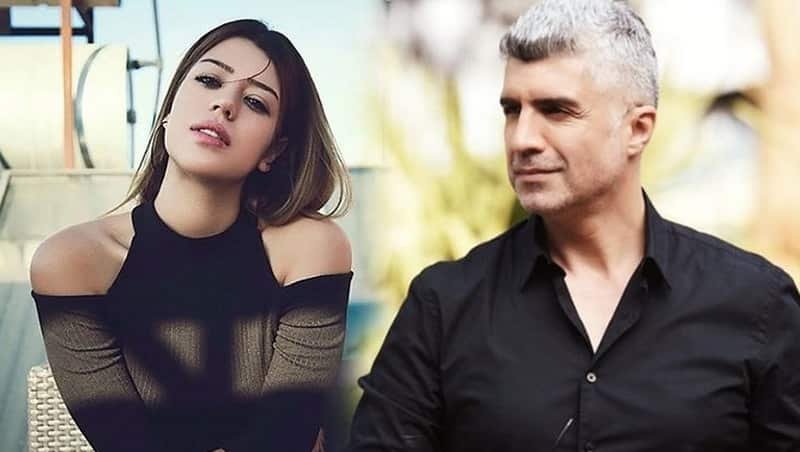 feyza aktan wearing a black dress without shoulders and long sleeves Özcan Deniz with white hair wearing a black shirt and looking to feyza senkron