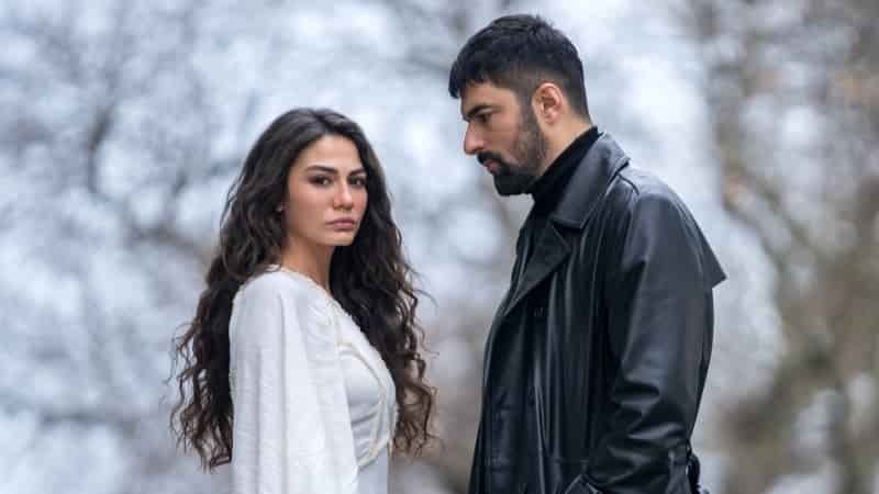 cover of turkish drama series remake of cleaning lady, benim adım, picturing Demet Özdemir as Farah wearing a white dress standing in front of Engin Akyürek portraying Tahir, who wears a black leather jacket looking at her partner