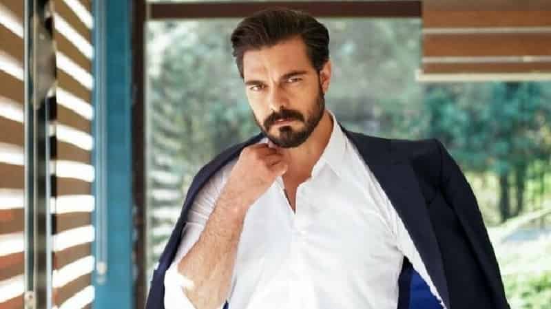 Halil Ibrahim Ceyhan wearing a white t-shirt with a blue jacket holding his right hand under chin, says goodbye to his role as yaman in emanet dizi drama series final