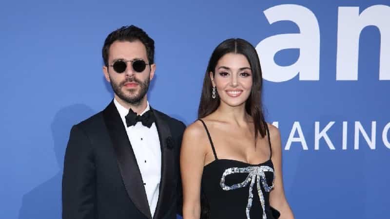 Hande Erçel wearing a dark dress and Hakan Sabancı couple Attending Sharon Stone's Donation Night at Film Festival de Cannes 2023